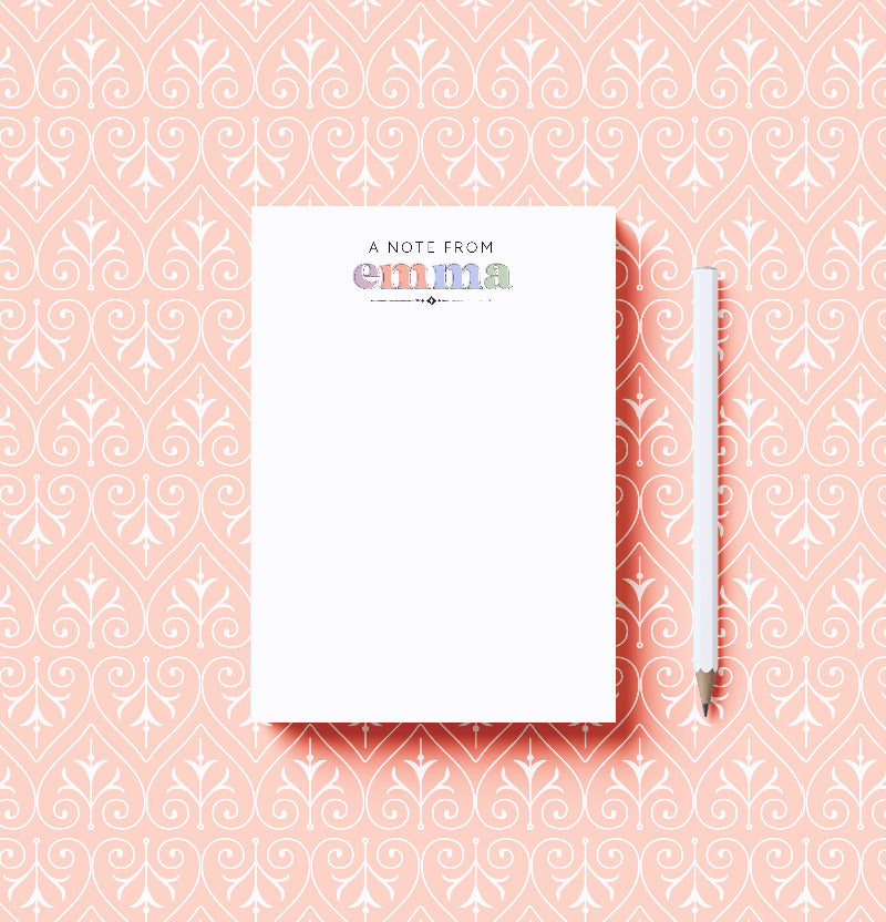 Notebook with 'A Note from Emma' on a pink patterned background