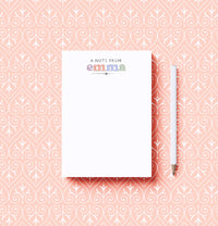 Notebook with 'A Note from Emma' on a pink patterned background