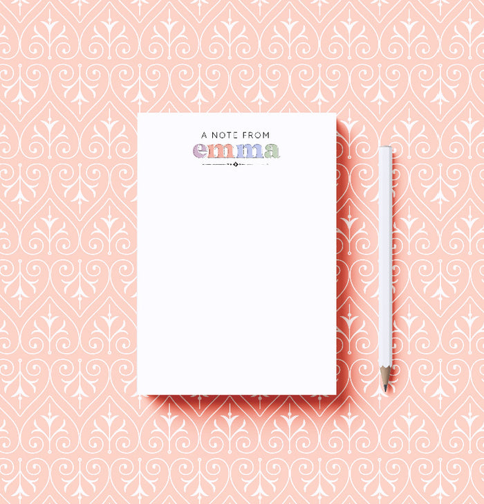 Notebook with 'A Note from Emma' on a pink patterned background