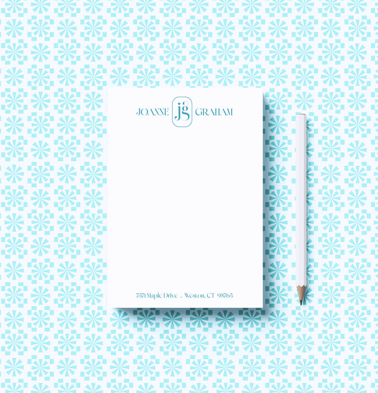 Notebook with a pencil on a patterned background