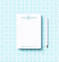 Notebook with a pencil on a patterned background