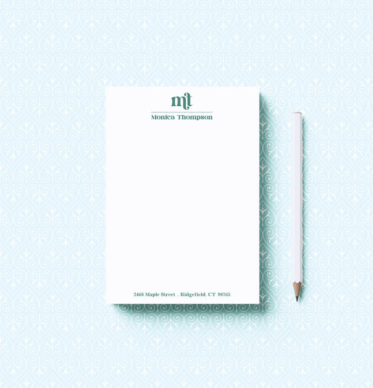 Notepad with a pencil on a light blue background