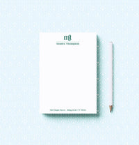 Notepad with a pencil on a light blue background