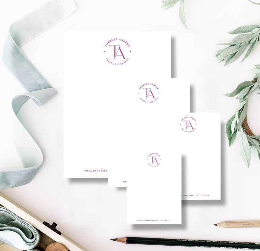 Stationery items with a brand logo on a white background